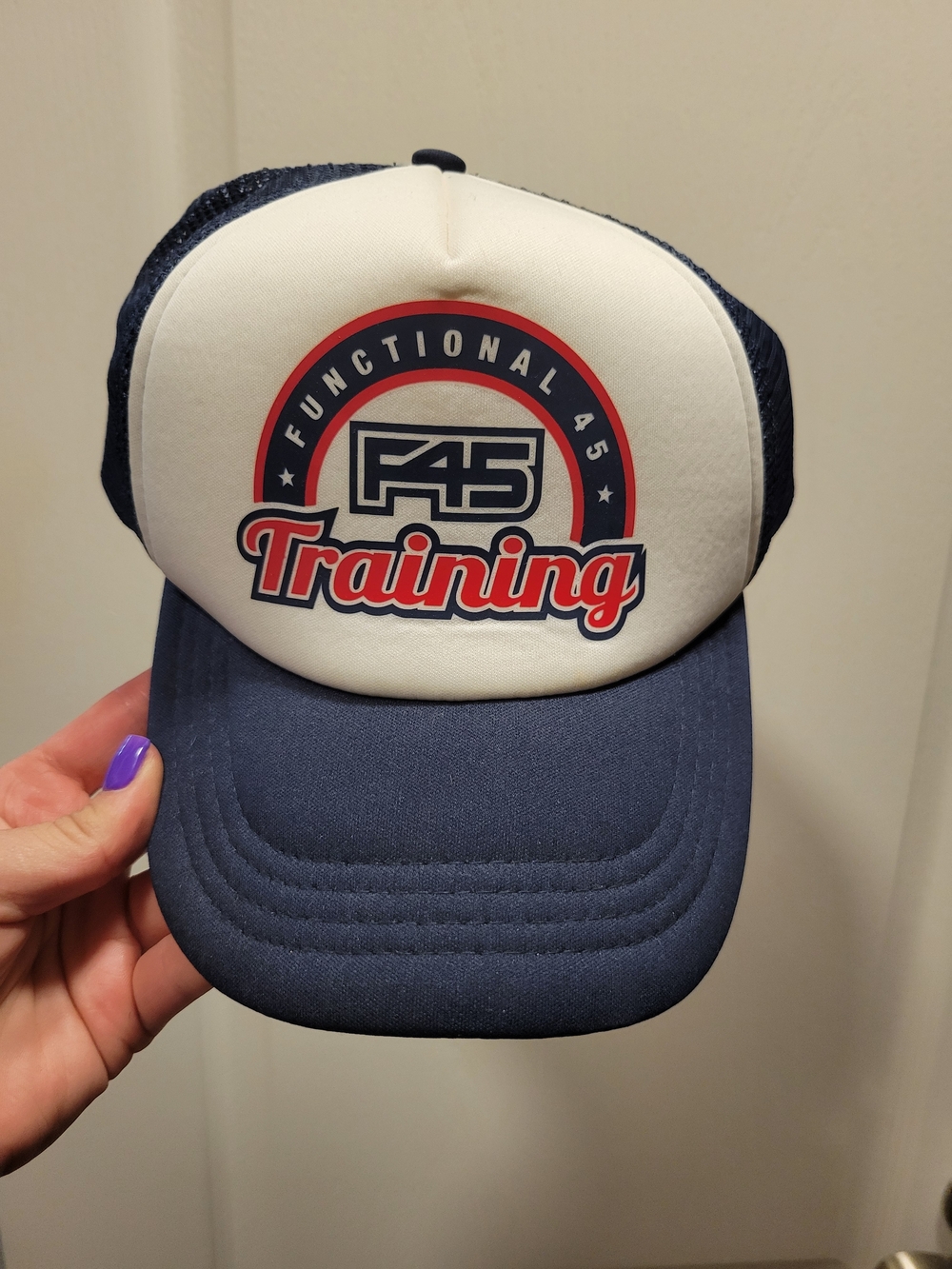 F45 Navy Trucker Cap with Red Logo Accents